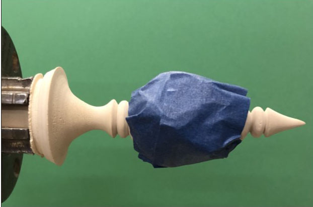 Finial wrapped in blue tape