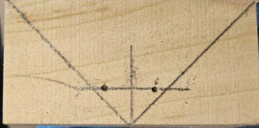 Draw the triangular base of a hear